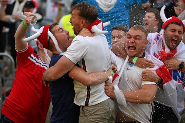TOPSHOT - England supporters react to England's third goal at the 4TheFans Fan Park in Manchester, north-west England on July 3, 2021, watching the UEFA EURO 2020 quarter-final football match between England and Ukraine being played in Rome. (Photo by Paul ELLIS / AFP) (Photo by PAUL ELLIS/AFP via Getty Images)