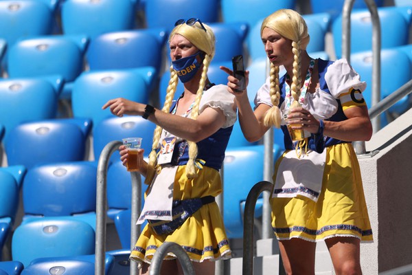 TOPSHOT - Sweden supporters attend the UEFA EURO 2020 Group E football match between Sweden and Slovakia at Saint Petersburg Stadium in Saint Petersburg on June 18, 2021. (Photo by LARS BARON / POOL / AFP) (Photo by LARS BARON/POOL/AFP via Getty Images)