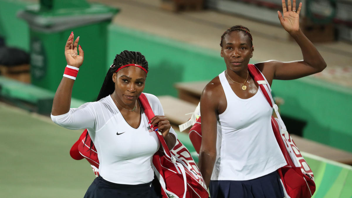 Aug 7, 2016; Rio de Janeiro, Brazil; Serena Williams (USA) and Venus Williams (USA) wave to the crowd after their game against Lucie Safarova (CZE, not pictured) and Barbora Strycova (CZE) during the women's doubles in the Rio 2016 Summer Olympic Games at Olympic Tennis Centre. Mandatory Credit: Jeff Swinger-USA TODAY Sports